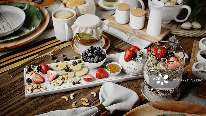 早餐桌上摆放着新鲜水果、酸奶杯和美味佳肴图片素材