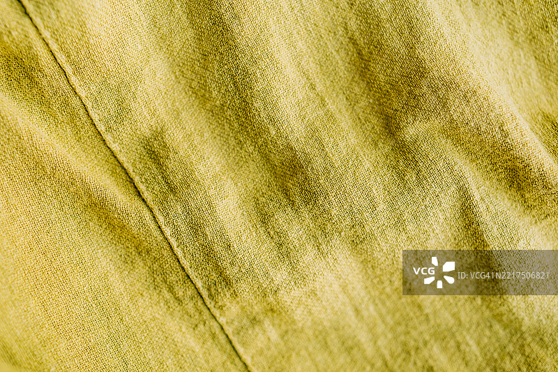 黄色亚麻布料的特写纹理图片素材