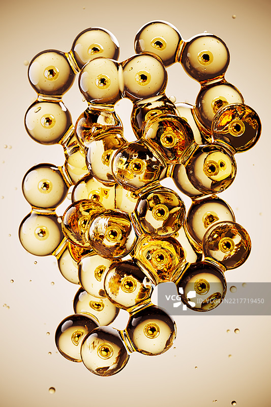 金色化妆品精华泡沫形成复杂结构图片素材