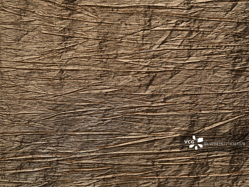 棕金色褶皱面料。粗糙纹理。阳光，自然色彩。比利时布鲁塞尔。全画幅 4:3图片素材