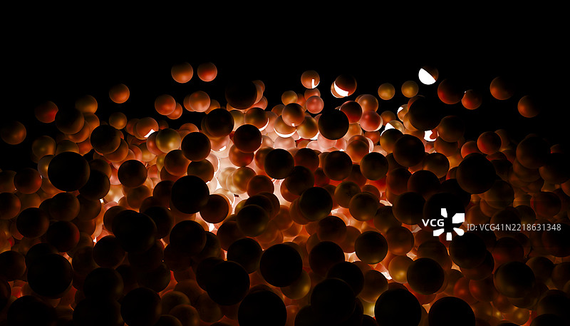 在黑暗中弹跳的发光红色球体图片素材