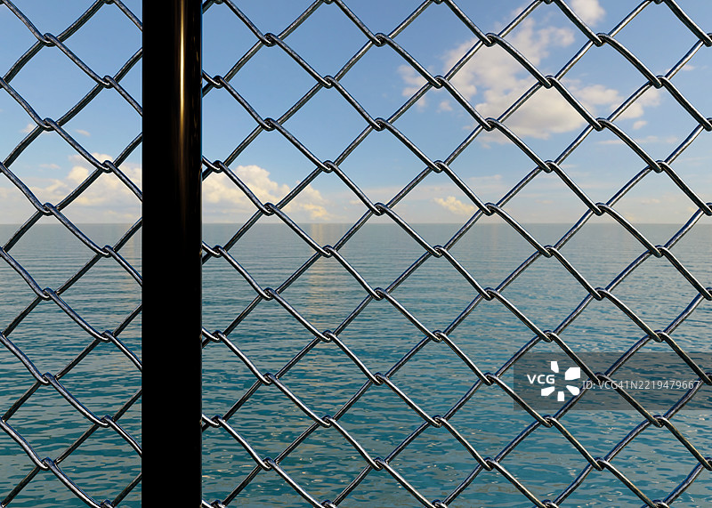 透过铁丝网看到的海景图片素材