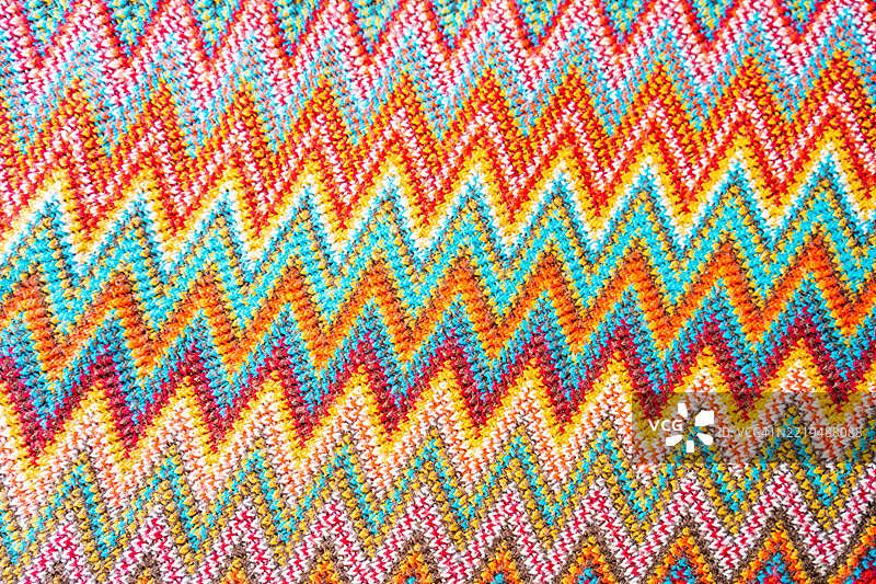 色彩斑斓的针织图案与钩编背景。图片素材