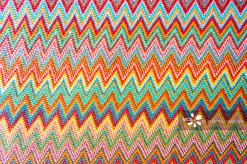 色彩斑斓的针织图案与钩织背景。图片素材