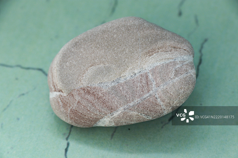 东努沙登加拉科尔班诺海滩的鹅卵石特写镜头图片素材