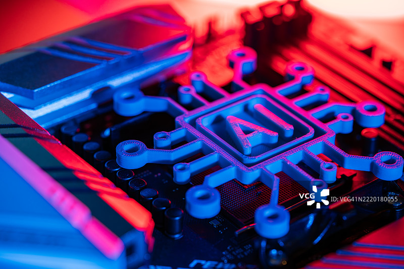 发光的人工智能符号放置在电脑主板上，散发着霓虹灯光。图片素材
