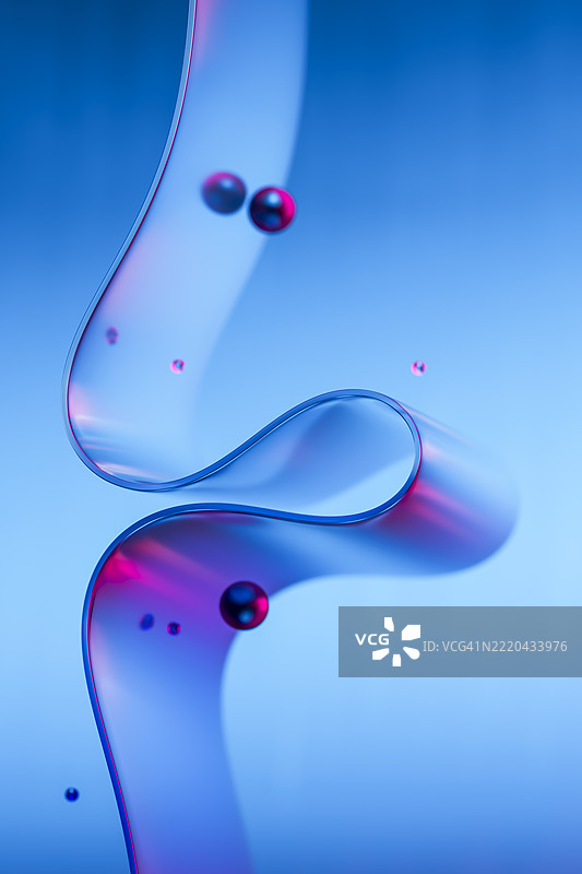 蓝色背景上的玻璃丝带和霓虹球的抽象3D设计图片素材