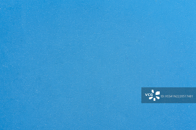 旧蓝色塑料背景。图片素材