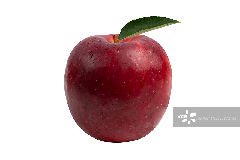 一个顶部有绿色叶子的红苹果图片素材