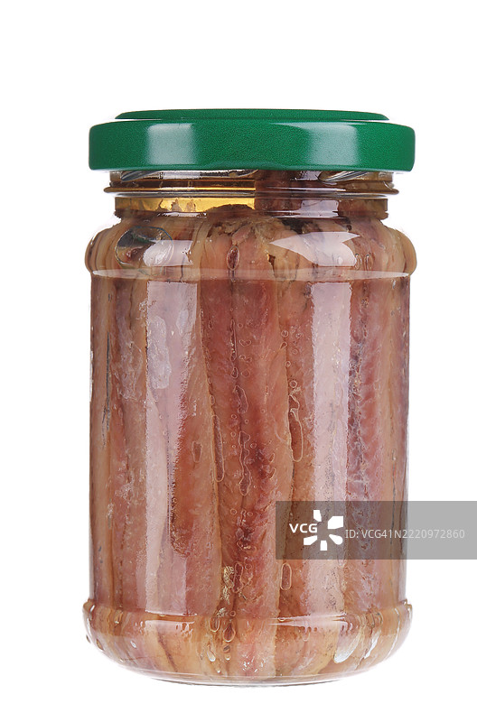 白色背景下罐子里的食物特写图片素材