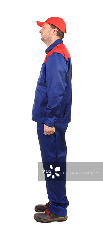 穿着蓝色和红色工装的男人图片素材
