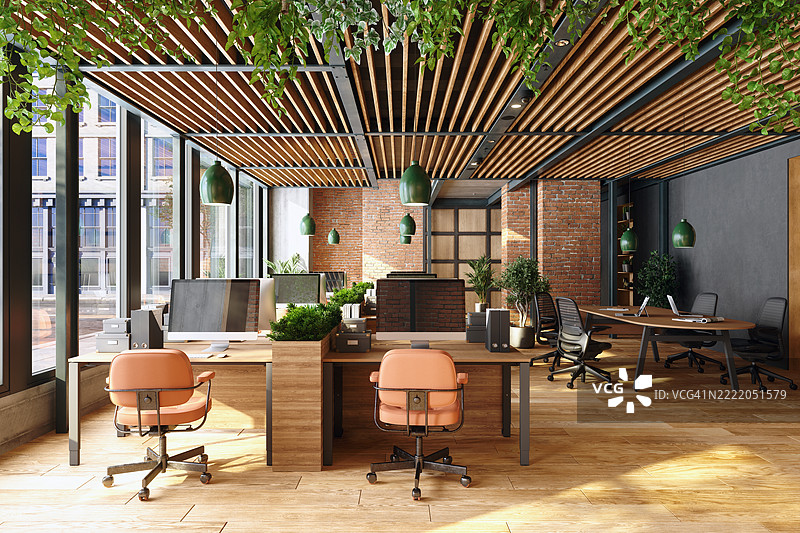 可持续的开放式现代办公室，配有桌子、椅子、吊灯和植物图片素材
