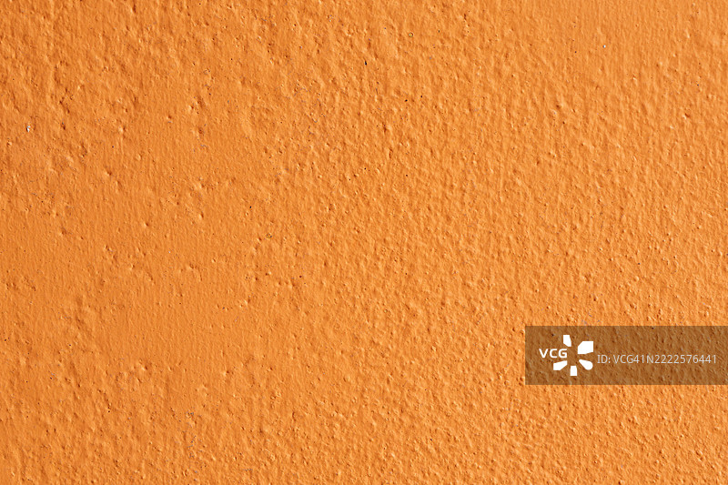橙色混凝土墙。图片素材
