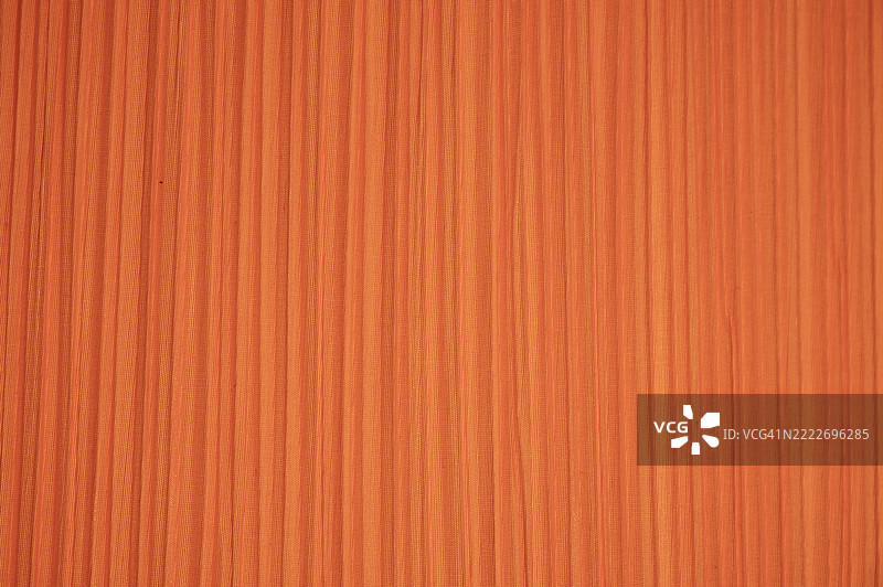 一面带有条纹图案的橙色墙壁特写图片素材