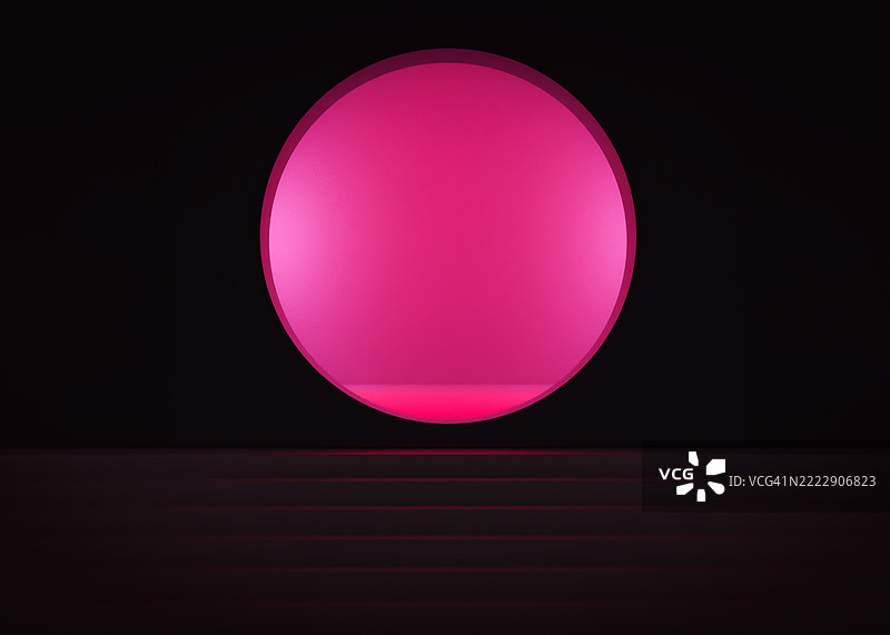 未来主义抽象装置，黑色背景上有极简主义的发光粉色圆圈图片素材