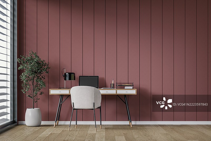 极简主义（斯堪的纳维亚风格）家庭办公室室内，桌子位于砖红色木板墙背景前，窗户和装饰品。图片素材