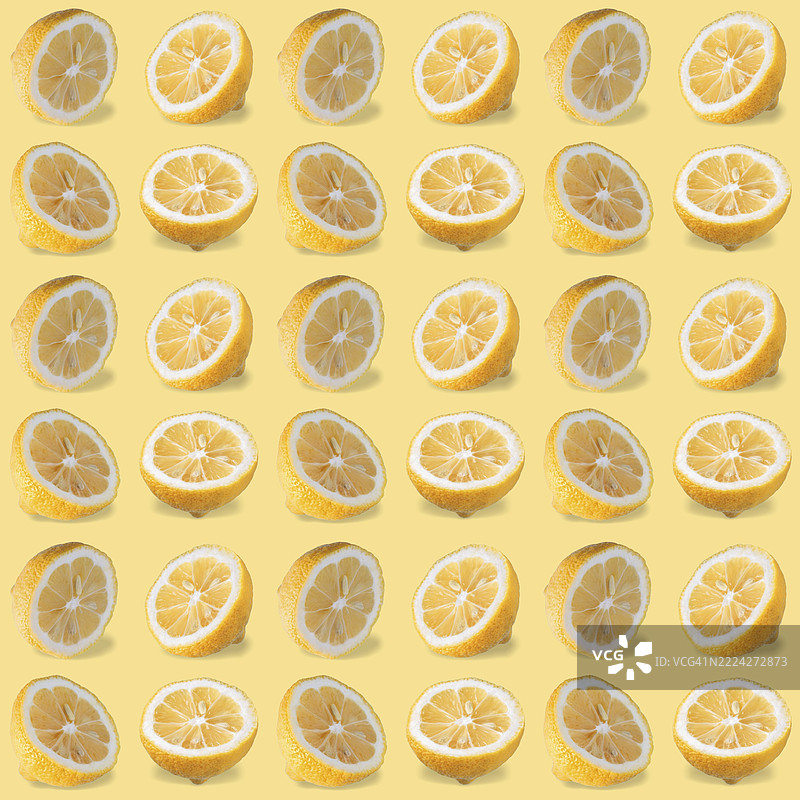 黄色背景上带阴影的柠檬片无缝图案图片素材