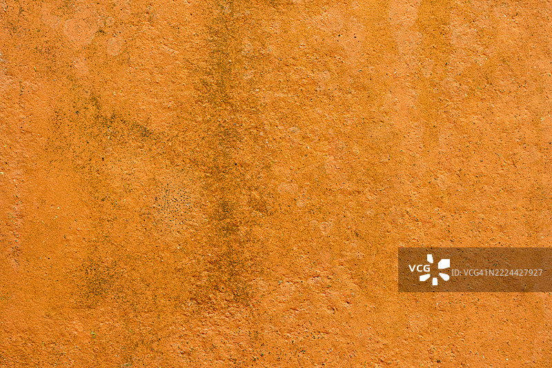 橙色混凝土墙。背景图片。图片素材