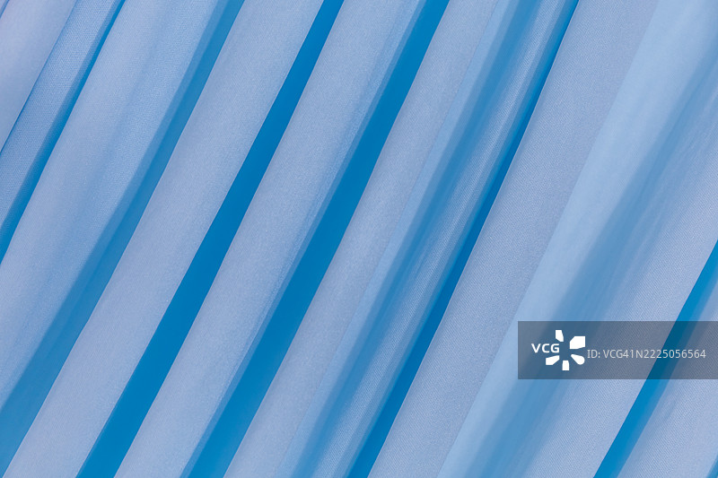 布料图案的背景图像，带有波浪褶皱的布料图片素材