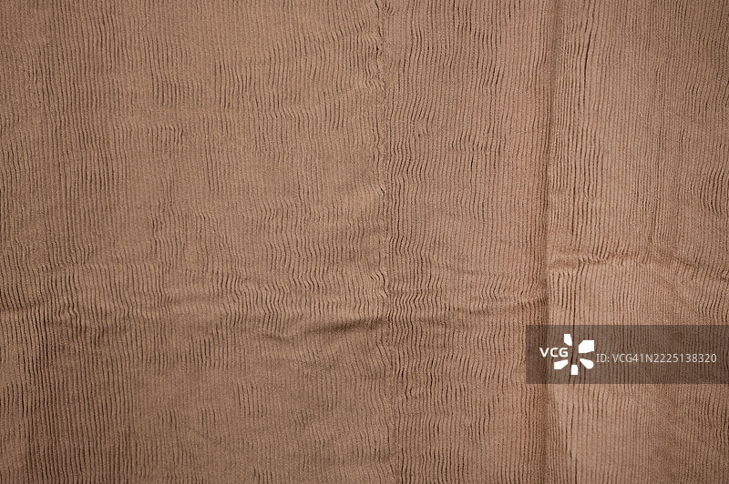 一块带有线条图案的浅棕色布料图片素材