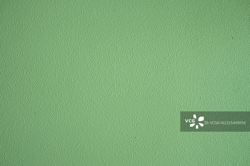 绿色墙面纹理背景的全景拍摄图片素材