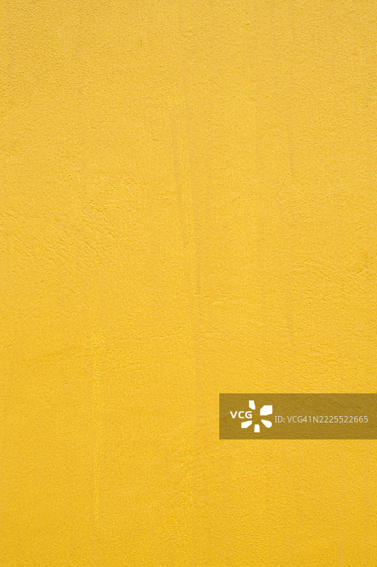 黄色水泥墙。图片素材