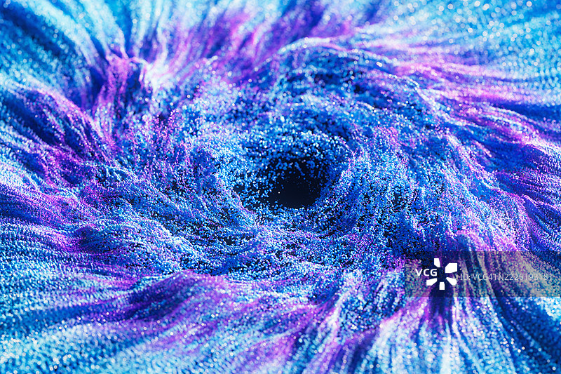 色彩斑斓的粒子从中心爆炸，形成未来感效果图片素材