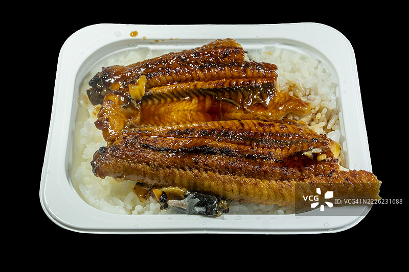 微波炉米饭上的鳗鱼长烧图片素材