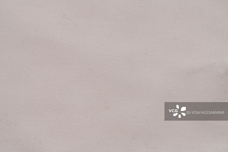 旧白色布料的特写。图片素材