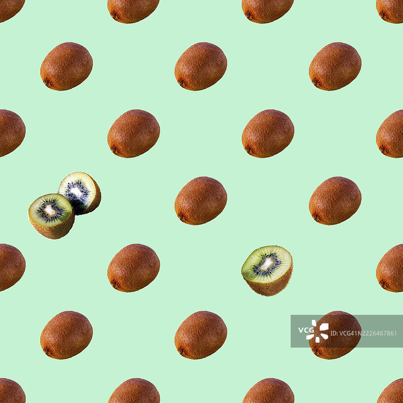蓝色背景上的猕猴桃，无缝图案图片素材