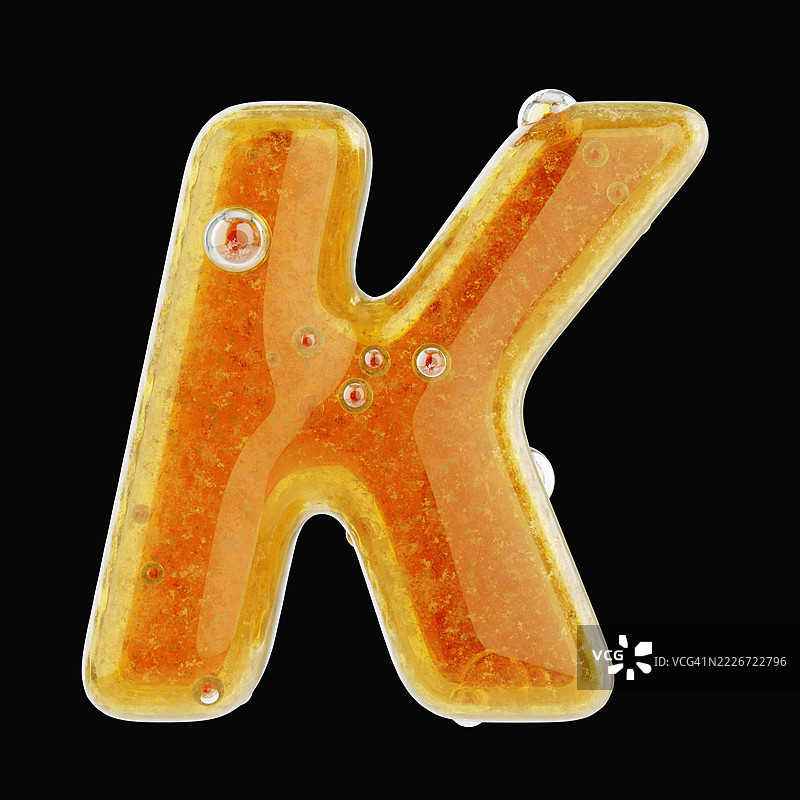 用流动的新鲜蜂蜜制成的字母K特写。图片素材