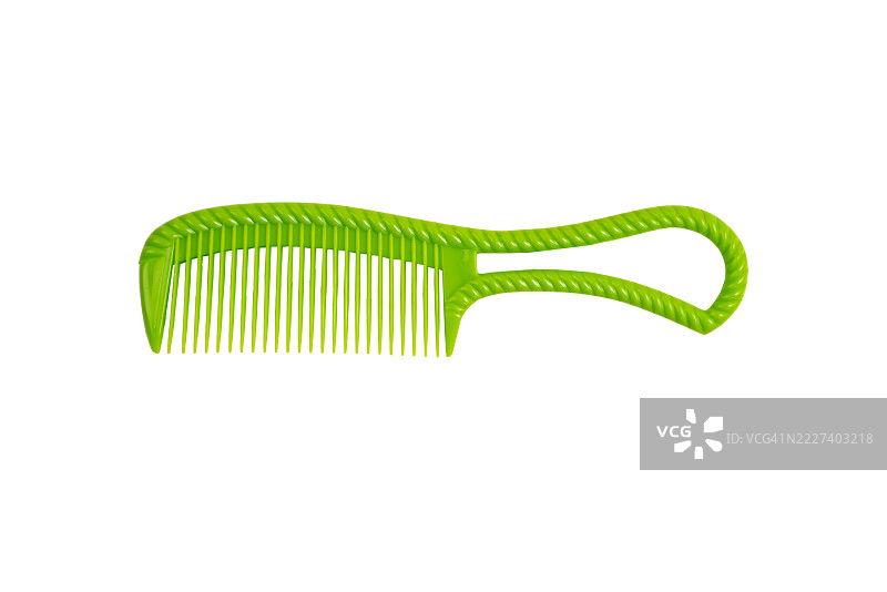 一把带绿色手柄的绿色塑料梳子图片素材