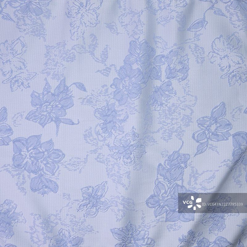 蓝色背景的花卉图案面料图片素材