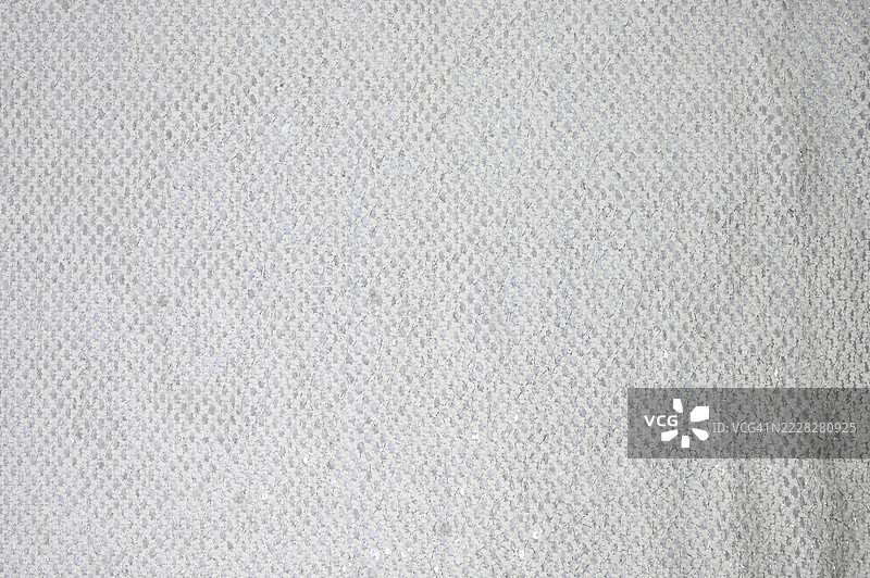 带有菱形图案的金属亮片面料。图片素材