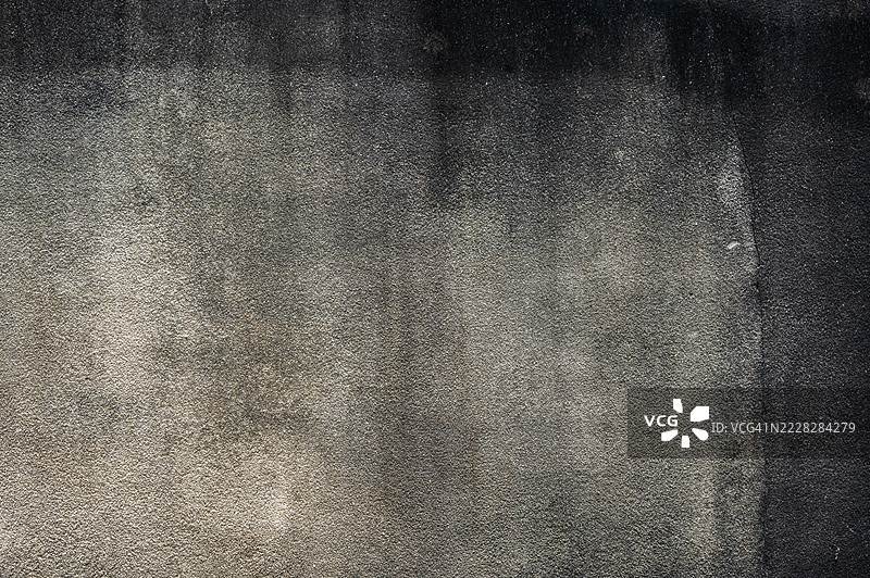 老旧水泥墙的纹理和背景特写镜头。图片素材