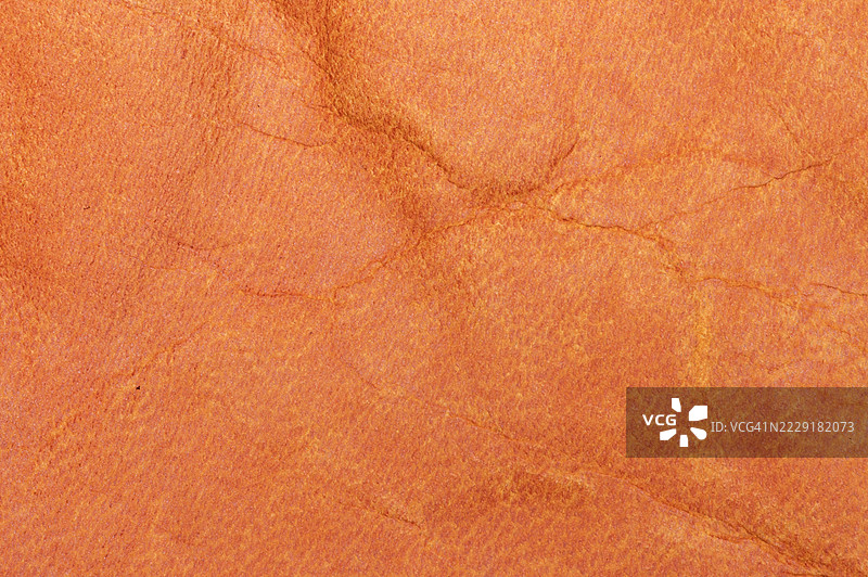 高分辨率的橙色皮革背景纹理全景拍摄图片素材