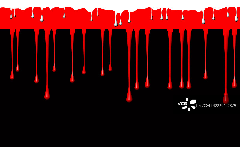 黑色背景上红色和白色的油漆滴落下来。图片素材