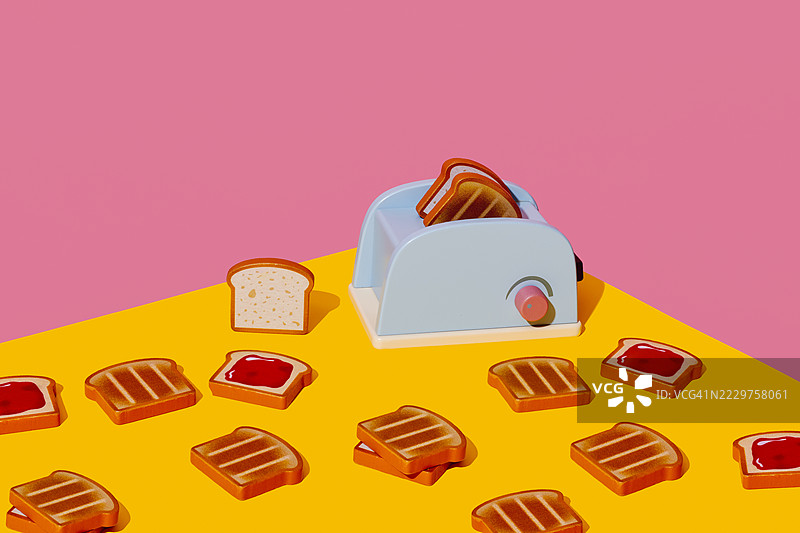 蓝色玩具烤面包机和烤好的面包在多彩背景下图片素材