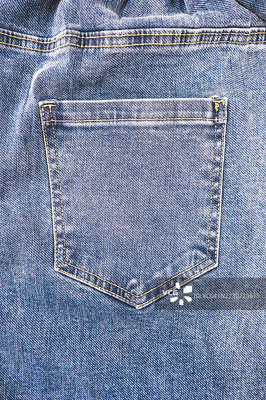 蓝色牛仔布纹理背景，特写。图片素材