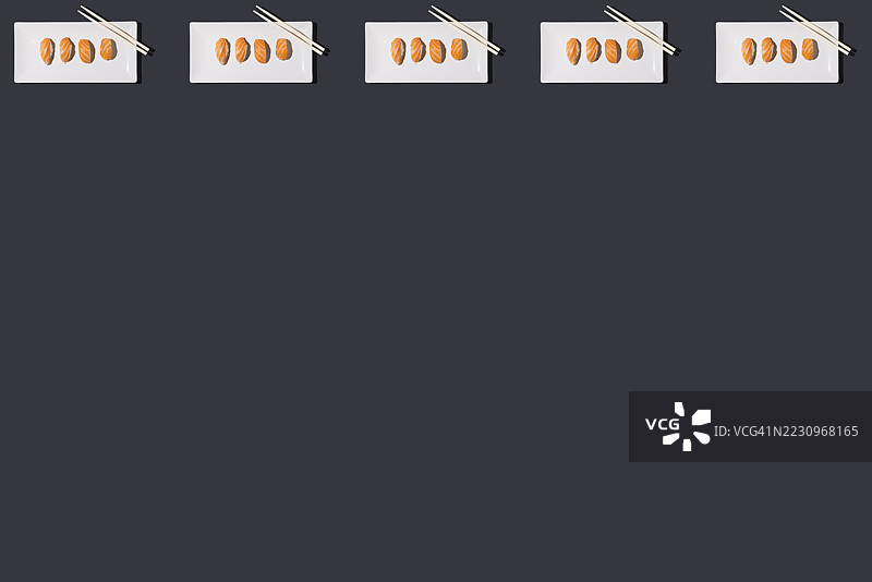 白盘上放着三文鱼握寿司米饭图案，旁边有筷子，背景为黑色。食物，日本，亚洲，健康食品，蛋白质和碳水化合物。图片素材