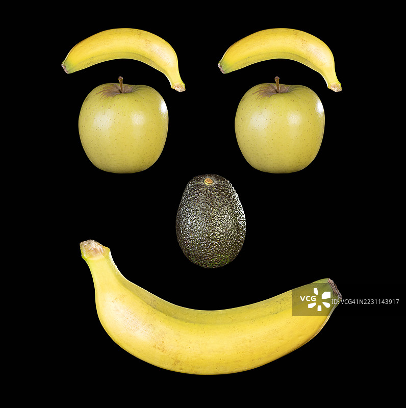整块水果组成一个微笑的人脸。图片素材