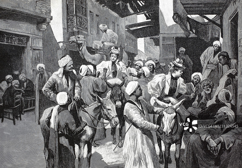 开罗,埃及的街头交易,彩色木刻版画,约1888年的原作复刻,历史场景,穿着传统服饰的人们在繁忙的市场上与骆驼,非洲,经过数字修复的旧版复刻,确切日期未知图片素材