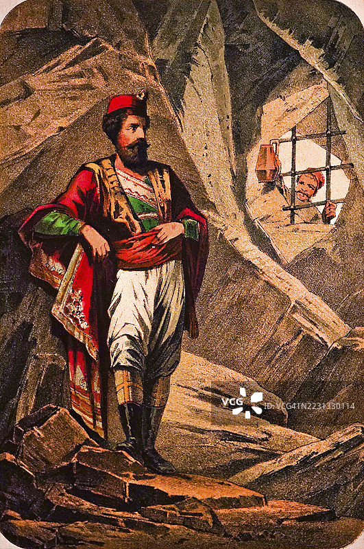 红色的蒙特尼格罗人被锁在岩石洞穴中，囚禁，叙述，高贵血统的男子穿着华丽的衣服，披风，皮靴，骄傲的神情，铁栏，拿着灯笼的守卫，彩色插图，黑山，1877年的历史插画图片素材