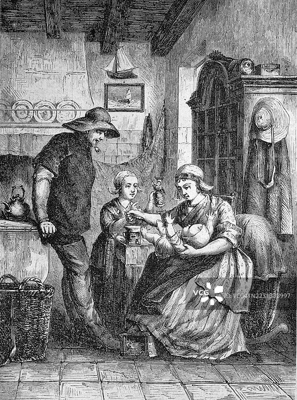 荷兰舍温宁根一家四口在厨房里捕鱼，历史场景，19世纪的模型复刻。图片素材