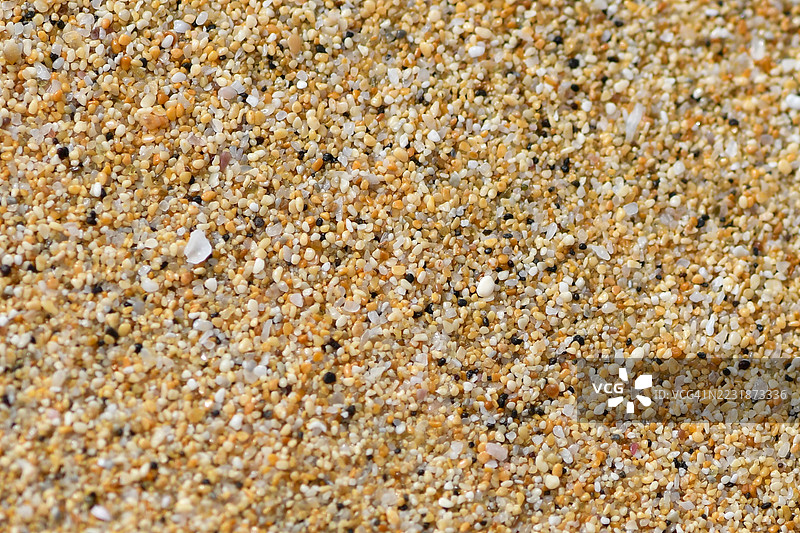粗糙沙粒的特写，形成了有纹理的背景图片素材