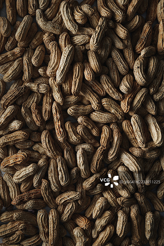 一堆未剥壳的花生特写镜头图片素材