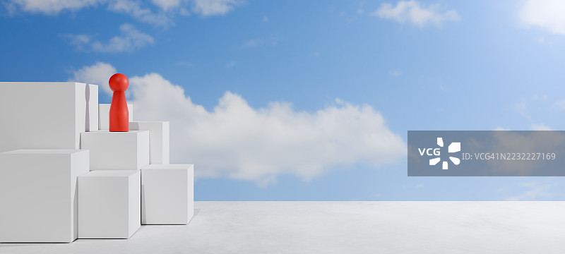 白色立方体上的红色玩具积木，背景是蓝天图片素材