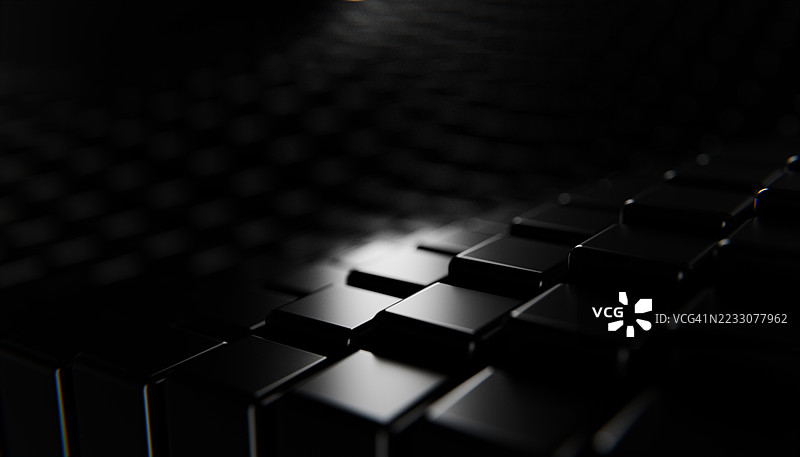 黑色立方体形成神秘的表面，反射光线图片素材