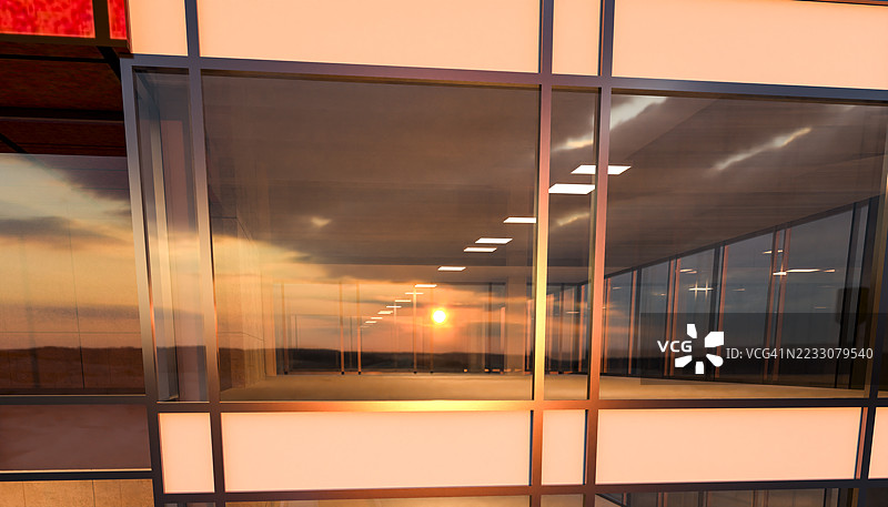 现代办公楼窗户上的日落倒影图片素材