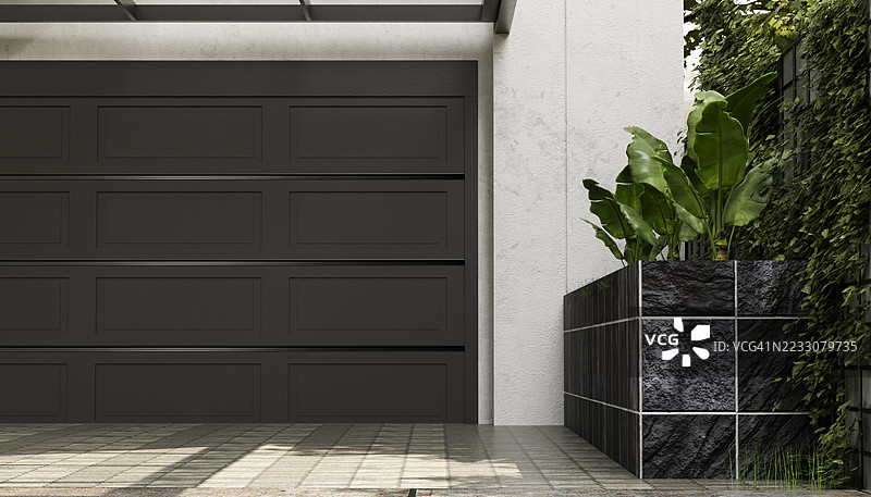 现代黑色车库门与植物和瓷砖花盆图片素材